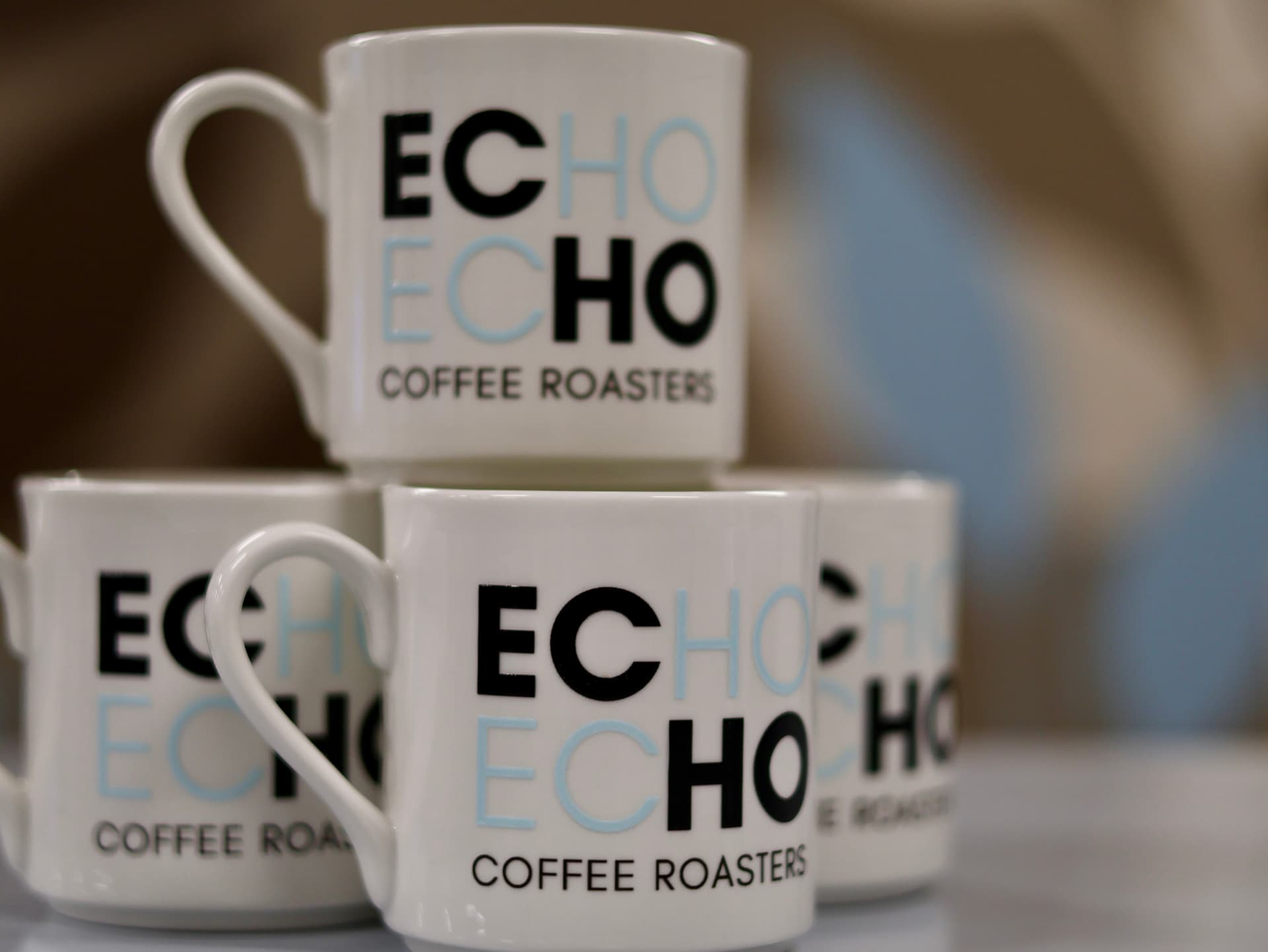 Stacked ECHO Coffee Roasters mugs